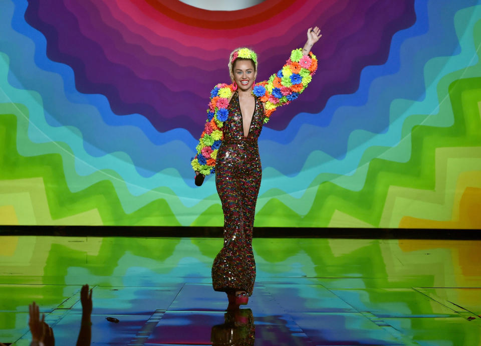 Miley Cyrus in a ROYGBV jumpsuit.