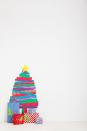 <p>Use washi tape, the Japanese masking tape that's become a U.S. crafting staple in recent years, to make a wildly-patterned "tree" that takes up zero floorspace and keeps the kids busy. You can also tape your holiday cards in a tree shape, or make a cute pegboard version.</p><p><em>Learn how to make a pegboard Christmas tree at </em><em><a href="https://sugarandcloth.com/diy-pegboard-christmas-tree/" rel="nofollow noopener" target="_blank" data-ylk="slk:Sugar & Cloth;elm:context_link;itc:0;sec:content-canvas" class="link ">Sugar & Cloth</a></em><em>.</em></p><p><a class="link " href="https://www.amazon.com/Rolls-Washi-Tape-Set-Scrapbooking/dp/B076K76CBV/?tag=syn-yahoo-20&ascsubtag=%5Bartid%7C10072.g.34454588%5Bsrc%7Cyahoo-us" rel="nofollow noopener" target="_blank" data-ylk="slk:SHOP WASHI TAPE;elm:context_link;itc:0;sec:content-canvas">SHOP WASHI TAPE</a></p>