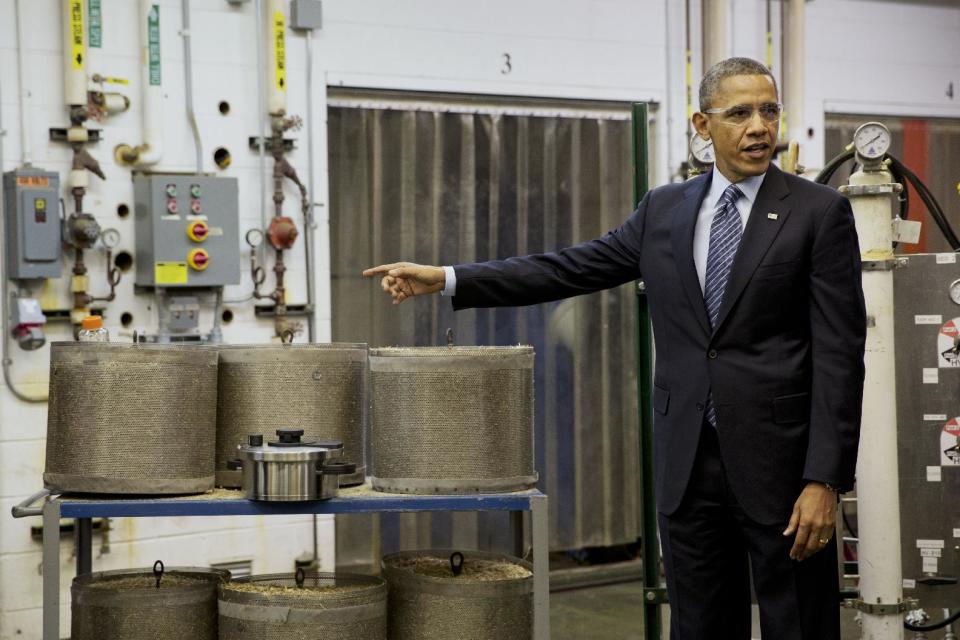 President Barack Obama tours the biomass conversion process area at the Michigan Biotechnology Institute in Lansing, Mich., Friday, Feb. 7, 2014. While in Michigan the president is expected to speak about the farm bill. (AP Photo/Jacquelyn Martin)