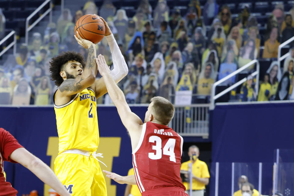 Jan 12, 2021; Ann Arbor, Michigan, USA;  Michigan Wolverines forward Isaiah Livers (2) shoots against Wisconsin Badgers guard Brad Davison (34) in the first half at Crisler Center. Mandatory Credit: Rick Osentoski-USA TODAY Sports