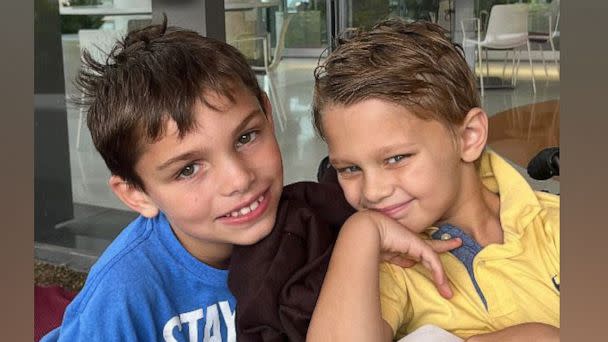PHOTO: Cooper Roberts, 8, who was paralyzed in the July 4, 2022, shooting in Highland Park, Ill., poses with his twin brother Luke. (Jason and Keely Roberts)