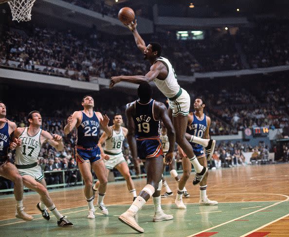 BOSTON, MA - 1964: Bill Russell #6 of the Boston Celtics shoots the ball against the New York Knicks circa 1964 at the Boston Garden in Boston, Massachusetts. NOTE TO USER: User expressly acknowledges and agrees that, by downloading and/or using this photograph, user is consenting to the terms and conditions of the Getty Images License Agreement. Mandatory Copyright Notice: Copyright 1964 NBAE (Photo by Dick Raphael/NBAE via Getty Images)