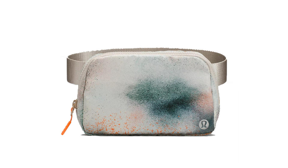 Light gray fanny pack with teal and orange spray splotch pattern.