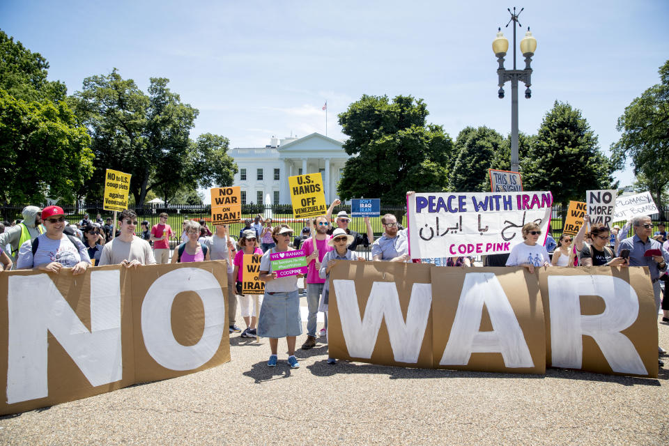 Members of the ANSWER Coalition hold an anti-war with Iran rally outside of the White House in Washington, Sunday, June 23, 2019. (AP Photo/Andrew Harnik)