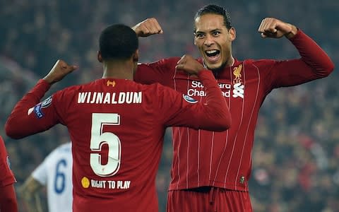 Georginio Wijnaldum celebrates scoring with  Virgil van Dijk - Credit: OLI SCARFF/AFP via Getty Images