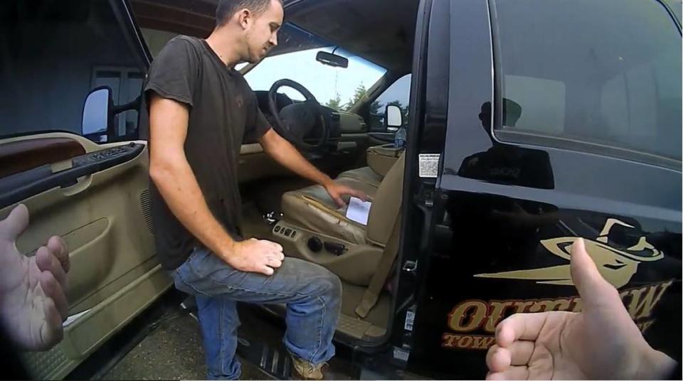 Body camera footage shows Kyle McLinn retrieving items from his truck as a Thomas County Sheriff’s deputy encourages him to allow a repossession to take place without a court order.