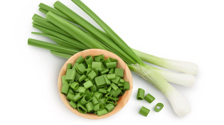 raw green onions in bowl
