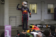 Red Bull driver Max Verstappen of the Netherlands celebrates after winning the Japanese Formula One Grand Prix at the Suzuka Circuit in Suzuka, central Japan, Sunday, Oct. 9, 2022. Verstappen secured second consecutive Formula One drivers' championship. (AP Photo/Toru Hanai)