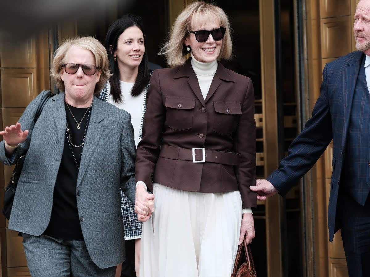 E Jean Carroll (center) leaves a Manhattan courthouse after a jury found Donald Trump liable for sexually abusing her in a Manhattan department store in the 1990s on 9 May 2023 in New York City (Spencer Platt/Getty Images)