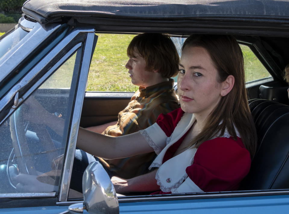 This image released by MGM shows Cooper Hoffman, left, and Alana Haim in a scene from "Licorice Pizza." (Melinda Sue Gordon/MGM via AP)