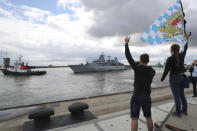 In this photo released by the Bundeswehr, well-wishers wave as Germany's naval frigate Bayern leaves the port of Wilhelmshaven, Germany, Aug. 2, 2021. Heading for the Indo-Pacific region, the crew will be underway for more than six months. (Nico Theska/Bundeswehr via AP)