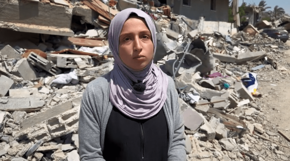 Siraj al-Najjar, 19, searches through the rubble of homes in Khan Younis looking for the remains of relatives. (NBC News)