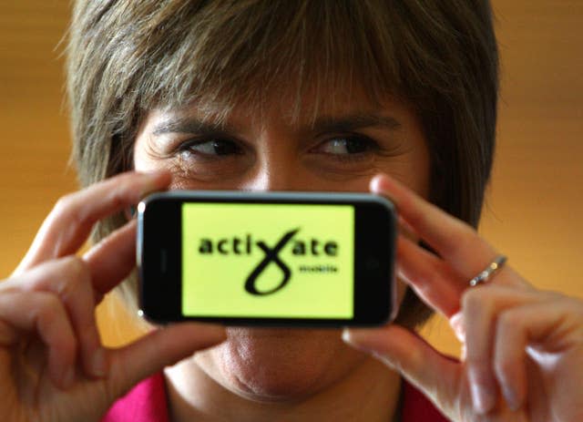 Helping to launch the SNPs online mobile campaigning system for activists in 2009 (PA)