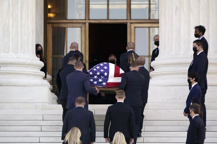 The flag-draped casket of Justice Ruth Bader Ginsburg arrives at the Supreme Court in Washington, Wednesday, Sept. 23, 2020. Ginsburg, 87, died of cancer on Sept. 18. (AP Photo/J. Scott Applewhite)