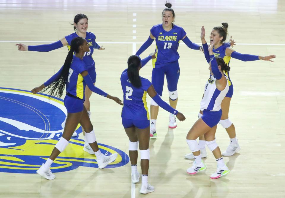 Delaware's (from left) Asia Murray, Madelyn Grunza (18), Lani Mason, Ezgi Basaranlar, Eileen Gex and Savannah Seemans celebrate a point in the Blue Hens' 3-1 win against Loyola (Md.) in the season-opening Blue Hen Invitational at the Bob Carpenter Center, Friday, August 25, 2023.