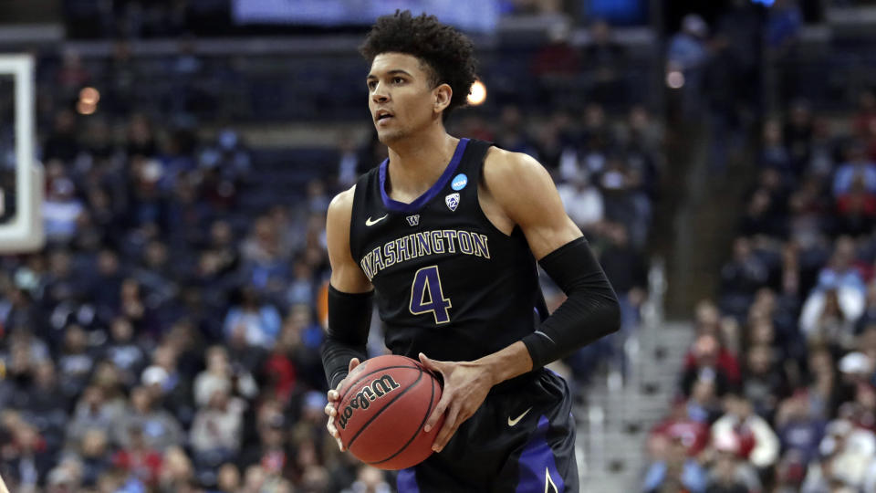 Washington's Matisse Thybulle looks to pass against Utah State in the first half during a first round men's college basketball game in the NCAA Tournament in Columbus, Ohio, Friday, March 22, 2019. (AP Photo/Tony Dejak)