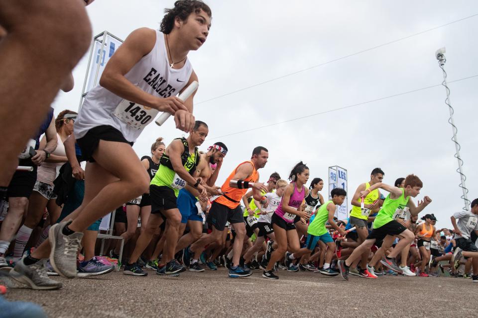 Racers take off at the start of the 44th annual Beach to Bay on Saturday, May 18, 2019.