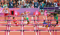 Balazs Baji of Hungary leads the pack as Xiang Liu of China falls over a hurdle in the Men's 110m Hurdles Round 1 Heats on Day 11 of the London 2012 Olympic Games at Olympic Stadium on August 7, 2012 in London, England. (Photo by Cameron Spencer/Getty Images)