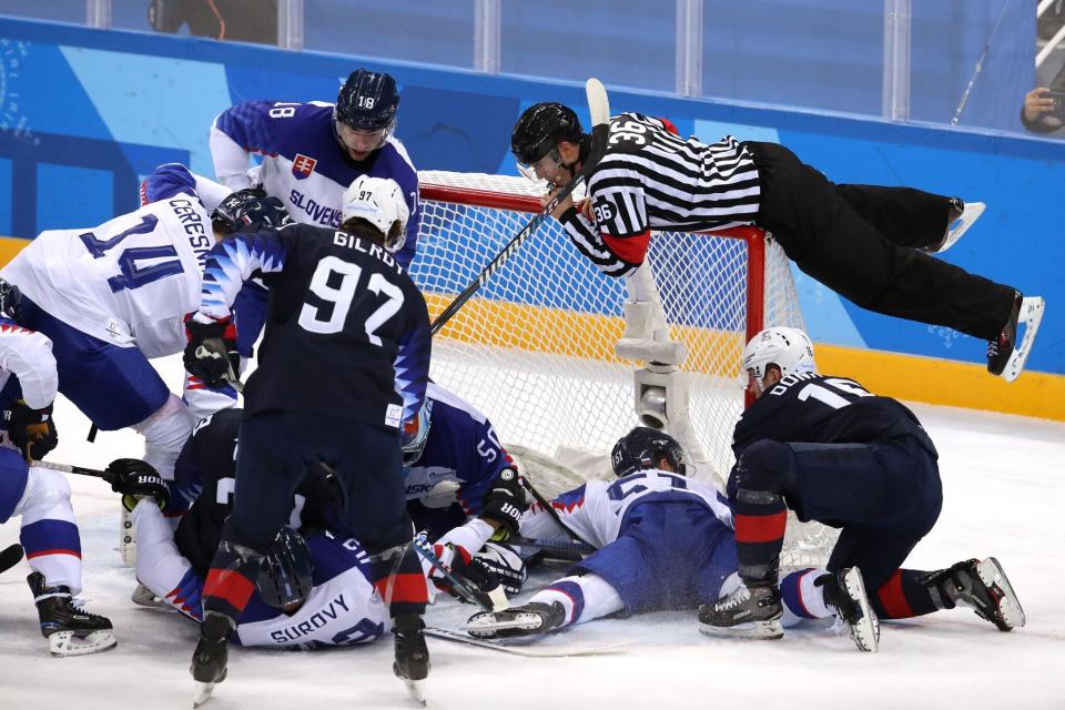 <p>Travis Lindquist, Senior Director, Editorial Photography, Getty Images Photo - Bruce Bennett</p><p>The officials in most sports prefer to be invisible. If people are talking about the officiating, it usually means controversy. But in a sport like hockey, it’s easy to forget just how close to the action and how athletic the officials are. In this image from Getty Images photographer Bruce Bennett, you can see an official jumping up on top of the goal to simultaneously avoid a collision and still be able to see the goal line in the scrum of hockey players below.</p>