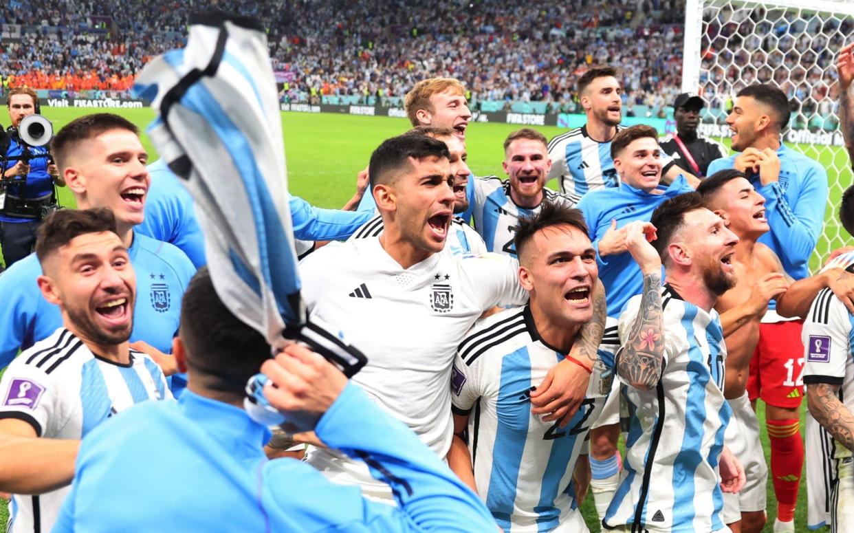 Argentina's Lionel Messi celebrates with his teammates after winning the FIFA World Cup Qatar 2022 quarter final match between Netherlands and Argentina at Lusail Stadium on December 9, 2022 in Lusail City, Qatar - Marc Atkins/Getty Images