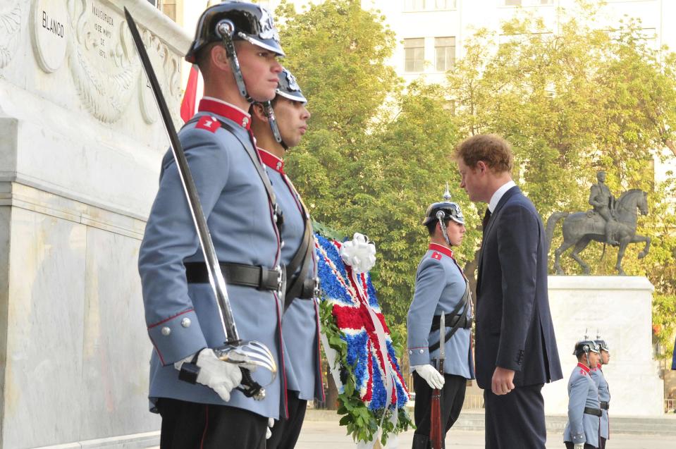 Britain's Prince Harry stands after laying a wreath in front of the Monument to Heroes of the Chilean Army in Santiago