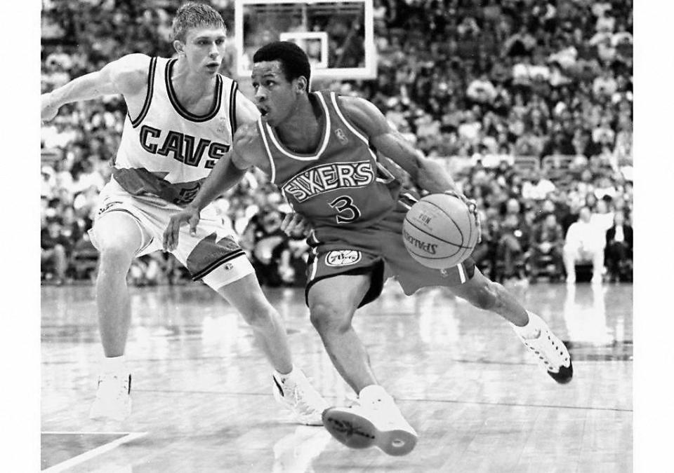 Then Philadelphia 76ers' rookie guard Allen Iverson (R) drives for the basket against Cleveland Cavaliers guard Bobby Sura (L) in game action. (KIMBERLY BARTH/AFP via Getty Images)