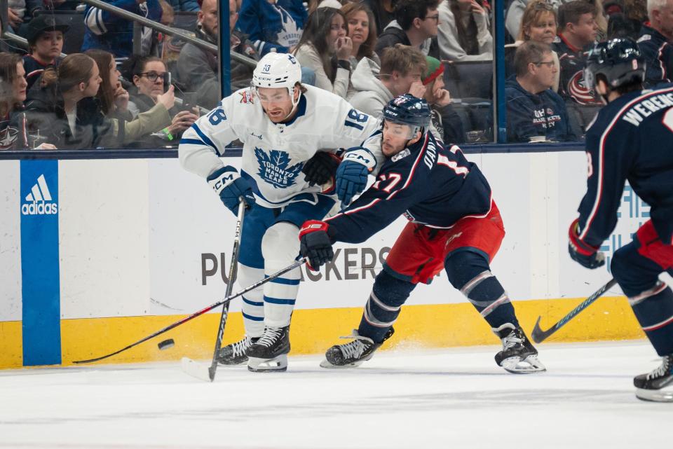 Dec 23, 2023; Columbus, Ohio, USA;
Columbus Blue Jackets right wing Justin Danforth (17) fights for the puck against Toronto Maple Leafs center Noah Gregor (18) during the second period of their game on Saturday, Dec. 23, 2023 at Nationwide Arena.