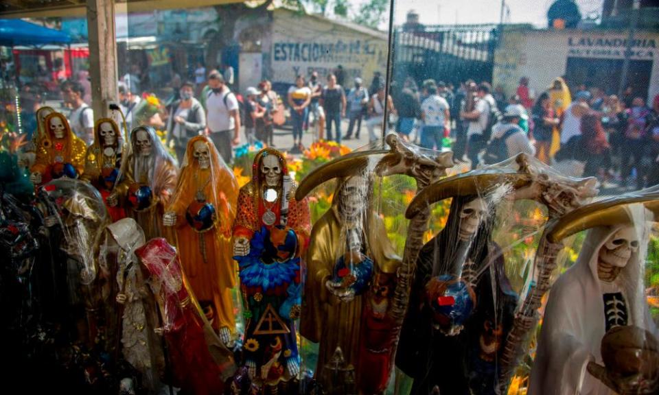 View of figures of Saint Death displayed for sale near its shrine on Alfareria street, in the Tepito neighborhood of Mexico City, October 2020.