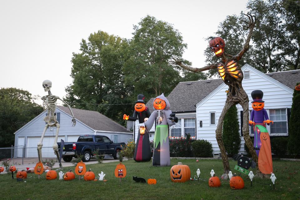 Inflatable pumpkin characters and large skeletons tower over the yard at 1350 E. Portland St. on Saturday, Oct. 7, 2023.