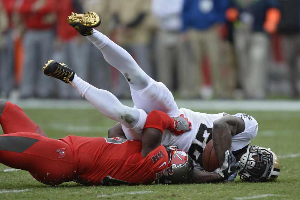 New Orleans Saints running back Latavius Murray (28) gets pulled down by Tampa Bay Buccaneers linebacker Devin White (45) during the first half of an NFL football game Sunday, Nov. 17, 2019, in Tampa, Fla. (AP Photo/Jason Behnken)