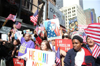 <p>Participants hold up signs and flags as they listen to guest speakers at the “I am a Muslim too” rally at Times Square in New York City on Feb. 19, 2017. (Gordon Donovan/Yahoo News) </p>