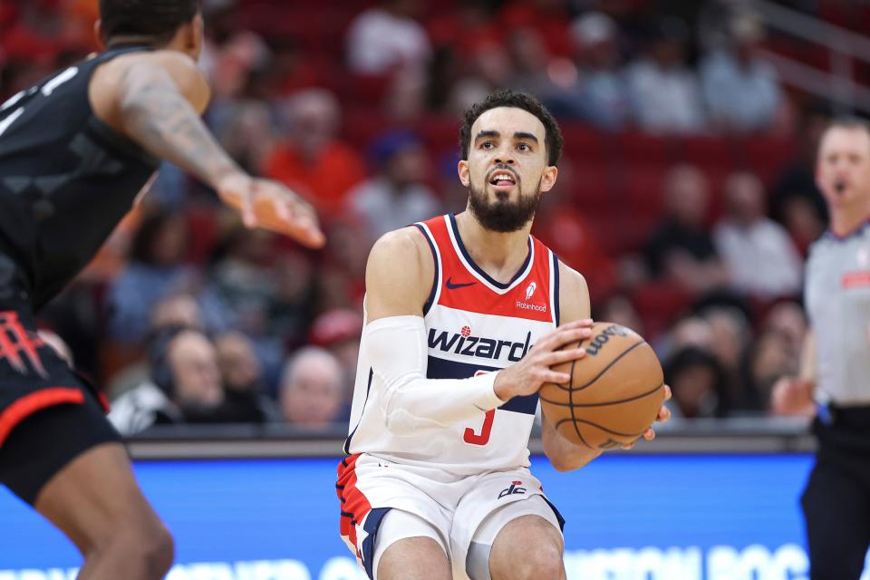 Mar 14, 2024; Houston, Texas, USA; Washington Wizards guard Tyus Jones (5) pulls up to shoot the ball during the third quarter against the Houston Rockets at Toyota Center. Mandatory Credit: Troy Taormina-USA TODAY Sports