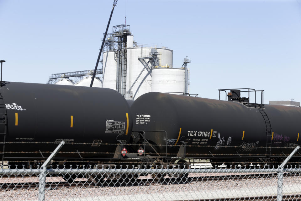 FILE - Ethanol train cars wait outside the Southwest Iowa Renewable Energy plant, an ethanol producer, in Council Bluffs, Iowa, on April 21, 2020. American consumers and nearly every industry will be affected if freight trains grind to a halt in December 2022. Chemical manufacturers and refineries will be some of the first businesses affected, because railroads will stop shipping hazardous chemicals about a week before the strike deadline to ensure that no tank cars filled with dangerous liquids wind up stranded. (AP Photo/Nati Harnik, File)