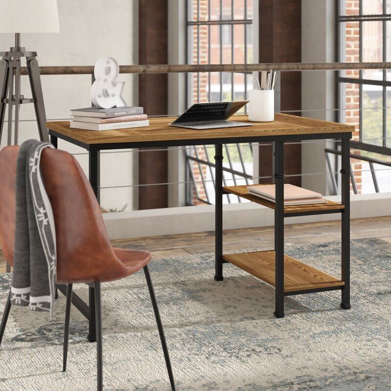 With the new normal of working from home, <a href="https://www.huffpost.com/entry/prime-day-deals-desks-office-chairs-2020_l_5f6cc742c5b6e2c912627d5c" target="_blank" rel="noopener noreferrer">office furniture</a> was something that lots of us were looking to save on this Prime Day. This desk was a popular choice for readers. It's easy to see why, since it has side shelves for books, supplies and folders. Plus, it's under $200 right now. <a href="https://fave.co/3djaaqE" target="_blank" rel="noopener noreferrer">Find it on sale for $196 at Wayfair</a>.