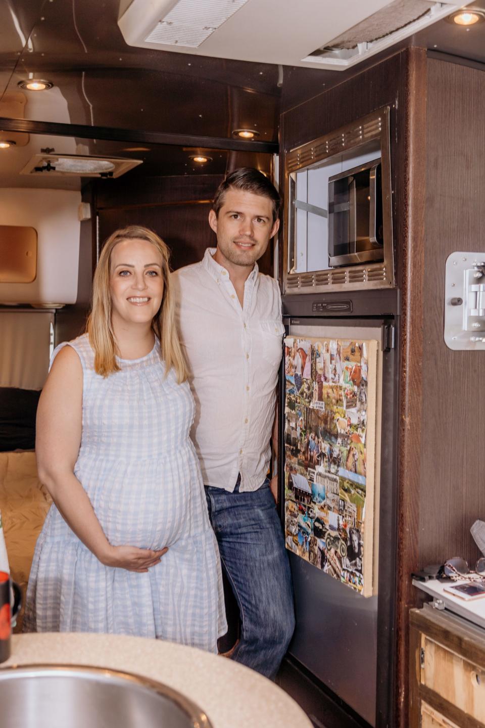 The couple in their Airstream while Heather was pregnant.