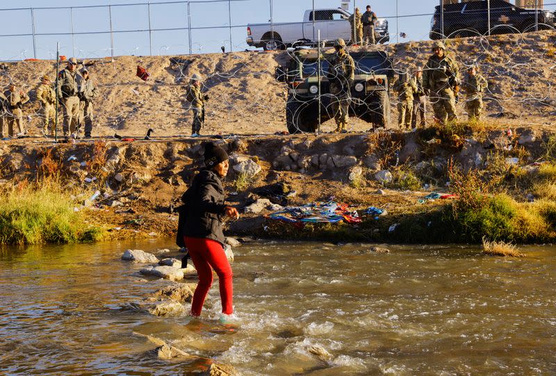 Members of the Texas National Guard stand guard on the banks of the Rio Bravo river with the purpose of reinforcing border security and inhibiting the crossing of migrants into the United States