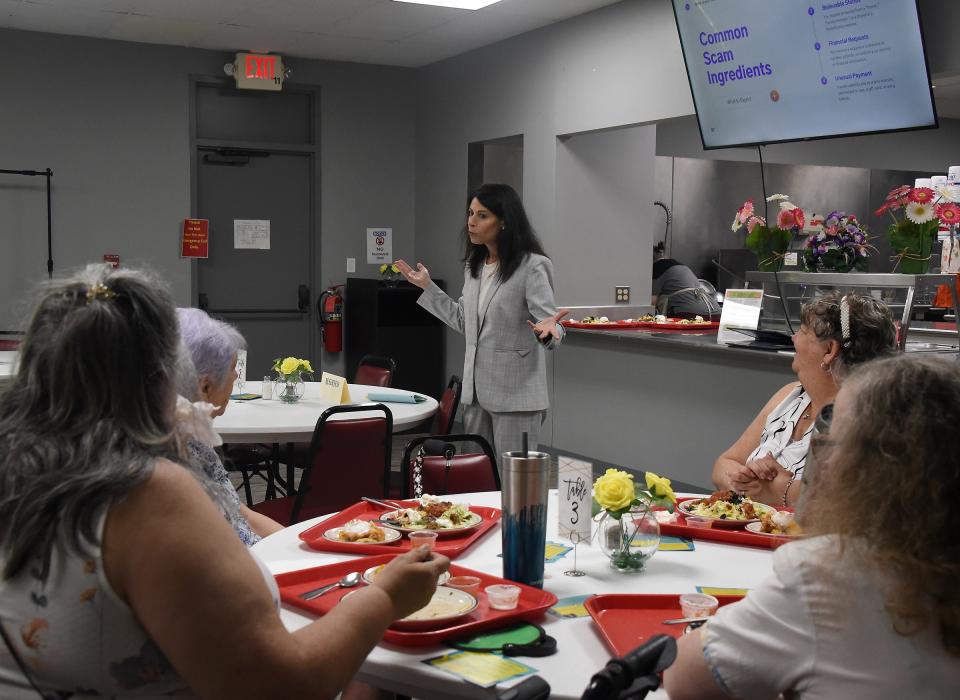 Michigan Attorney General Dana Nessel talks with seniors Tuesday at the Frenchtown Center for Active Adults about scams and consumer protection.