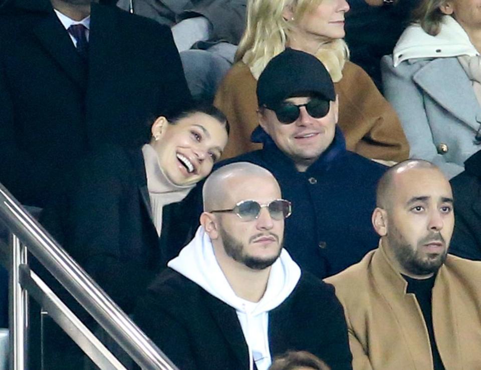 Leonardo DiCaprio and his girlfriend Camila Morrone, below DJ Snake attend the UEFA Champions League Group C match between Paris Saint-Germain (PSG) and Liverpool FC at Parc des Princes stadium on November 28, 2018 in Paris, France