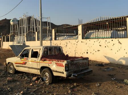 A car sits next to a salvage yard hit by a Houthi rocket in an industrial area in eastern Najran city, Saudi Arabia August 27, 2016. REUTERS/Katie Paul