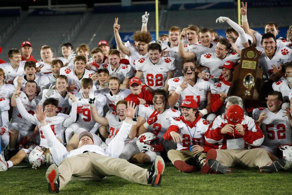 Beechwood celebrates with the trophy after defeating Lexington Christian for the second year in a row in the Class 2A state championship game at Kroger Field.