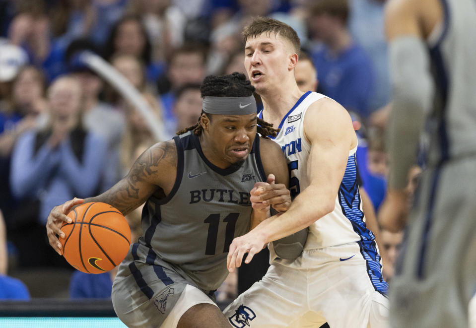 Butler's Jahmyl Telfort, left, drives against Creighton's Baylor Scheierman during the second half of an NCAA college basketball game Friday, Feb. 2, 2024, in Omaha, Neb. Butler defeated Creighton 99-98. (AP Photo/Rebecca S. Gratz)