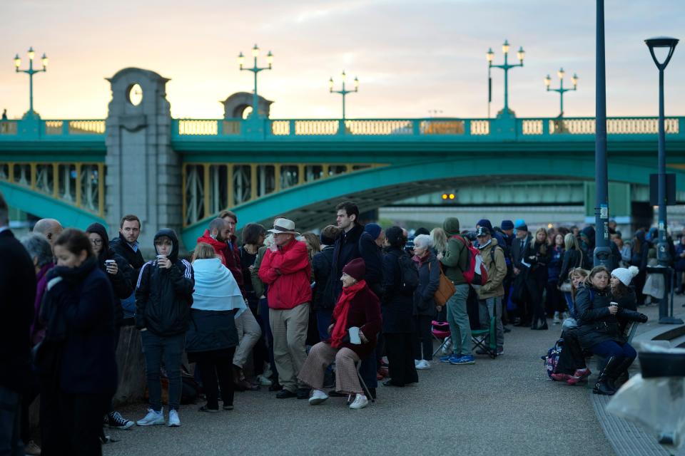 People wait in a queue to pay their respect to the late Queen Elizabeth II (AP)