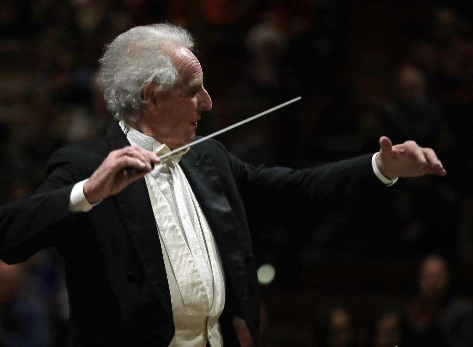 In this Feb. 14, 2019 photo, Benjamin Zander conducts the Boston Philharmonic Orchestra at the Sanders Theatre in Cambridge, Mass. The internationally acclaimed conductor, who approaches his 80th birthday on March 9, has spent half his life leading the Boston Philharmonic Orchestra, which he founded in 1979. (AP Photo/Elise Amendola)