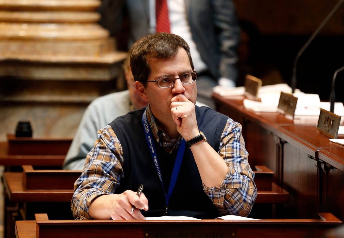 Lexington Herald-Leader reporter John Cheves at his desk on the floor of the Senate Chambers in the State Capitol in Frankfort, Ky.