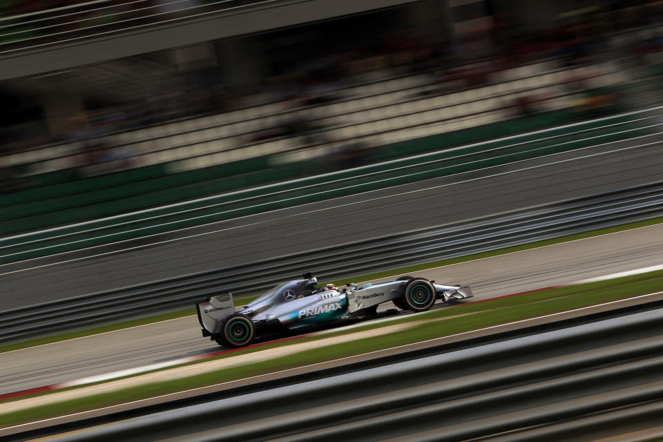 Mercedes driver Lewis Hamilton of Britain steers his car during the Malaysian Formula One Grand Prix at Sepang International Circuit in Sepang, Malaysia, Sunday, March 30, 2014. Hamilton won the race. (AP Photo/Lai Seng Sin)