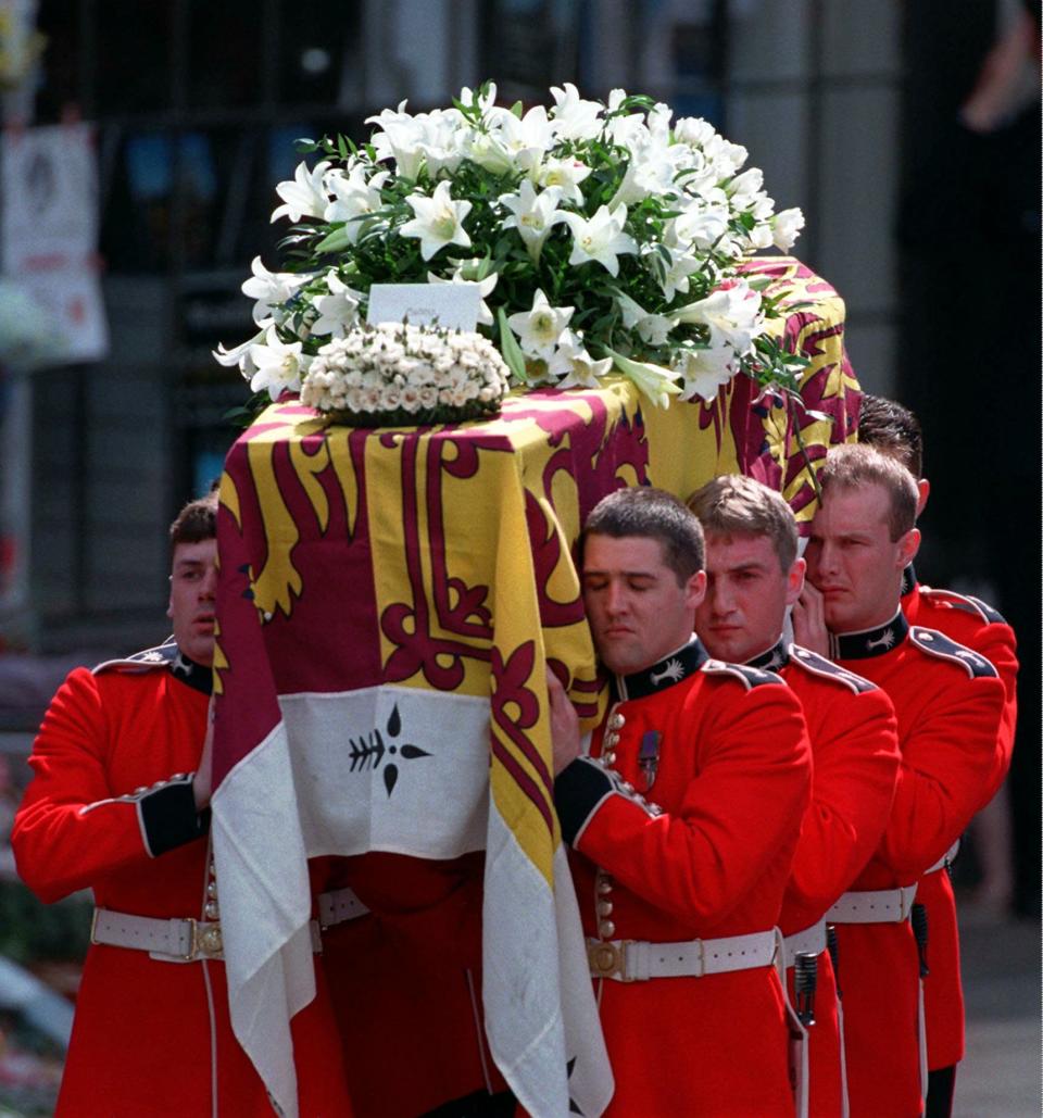 Princess Diana's casket is carried out of Westminster Abbey after her funeral in London, Saturday, Sept. 6, 1997. (AP Photo/Peter Dejong, pool)