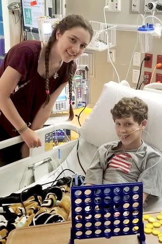 <p>Courtesy Rebecca's Wish</p> Rebecca Taylor visiting a pancreatitis patient