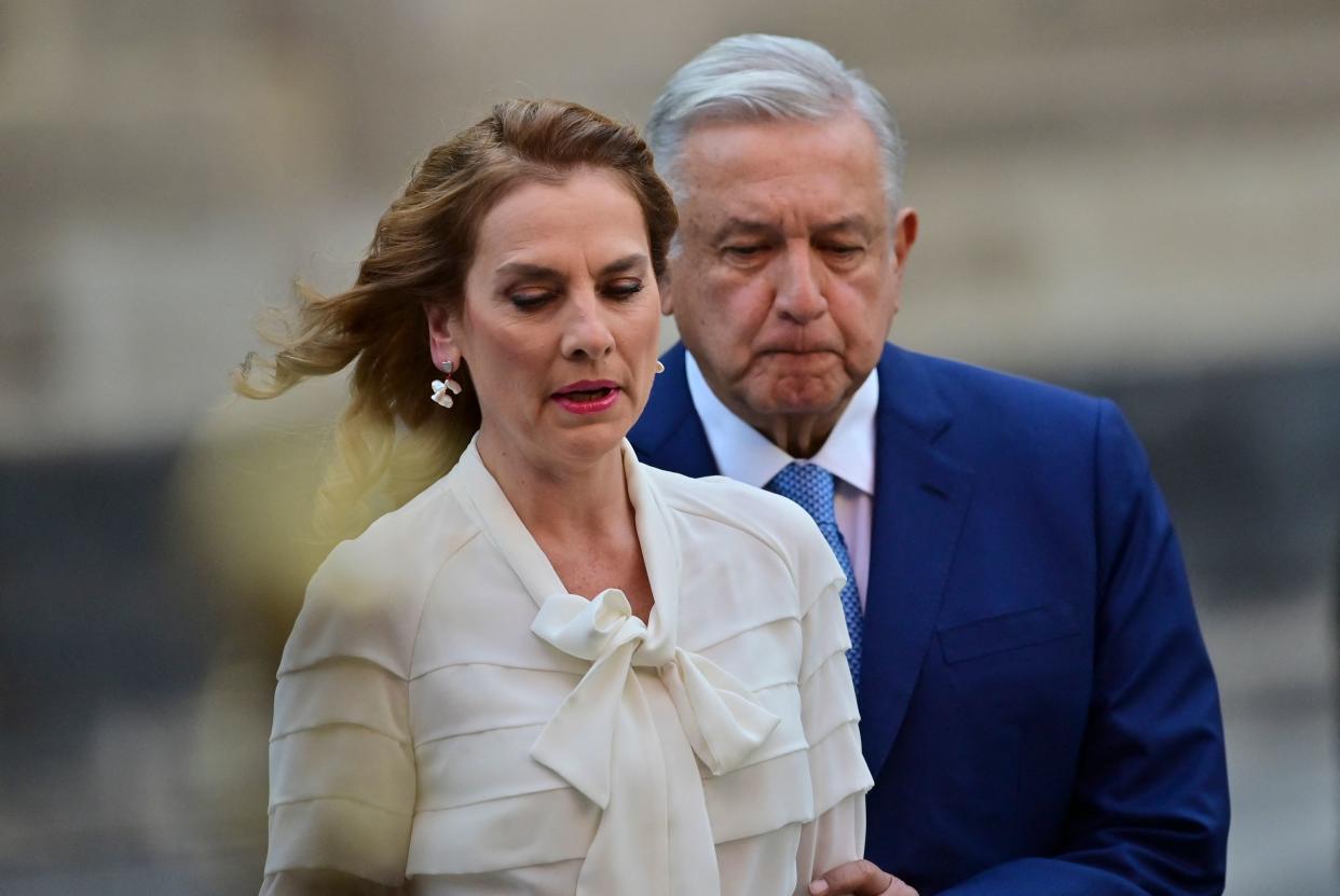 Mexican President Andres Manuel Lopez Obrador (R) and his wife, First Lady Beatriz Gutierrez, arrive for a ceremony to mark the 100th day of his third year in office, at the National Palace in Mexico City, on March 30, 2021. (Photo by Pedro PARDO / AFP) (Photo by PEDRO PARDO/AFP via Getty Images)