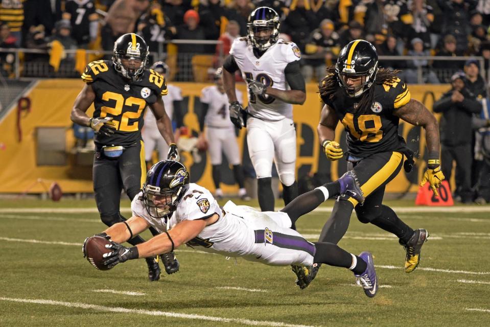Baltimore Ravens fullback Kyle Juszczyk (44) dives into the end zone for a touchdown during the second half of an NFL football game against the Pittsburgh Steelers in Pittsburgh, Sunday, Dec. 25, 2016. (AP Photo/Fred Vuich)
