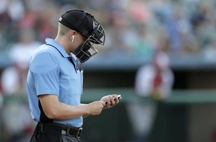 MLB strikes deal with umpires that could open door for automated strike zone. (AP)